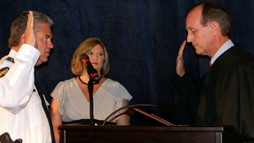 James Pohlmann, with wife, Monique next to him, as sworn in by Louisiana Supreme Court Justice John Weimer.