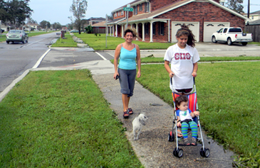 When the sun came out Thursday, Sonia Gavarrete of Chalmette, in the background, came out to take a walk along Jean Lafitte Parkway with Erica Alfaro, who is pushing the stroller carrying baby Christina Fernandez. With them is their dog, Trixie.  “We’ve been in the house two days. It’s great to see the sun come out,’’ said Gavarrete.