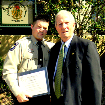  Deputy Robert Mire with his uncle, retired FBI Special Agent Jim Mire, who presrnted his nephew’s certificate. 