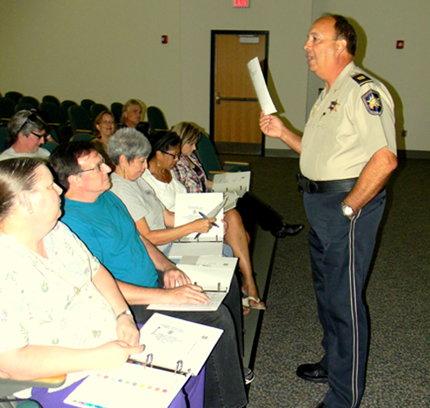 Capt. Charles Borchers, who conducts the classes, speaks to its members.       