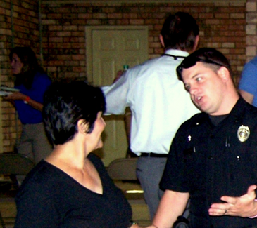 St. Bernard Parish Sheriff’s Deputy Daniel Carreras is shown answering a question from Carol Beaubouef at a Night Out Against Crime event she held at her home in October 2011. This year’s event in St. Bernard is scheduled for Oct. 16. Call 278-7628 to register your event and a sheriff’s deputy can be sent out to give crime prevention tips and answer any questions.