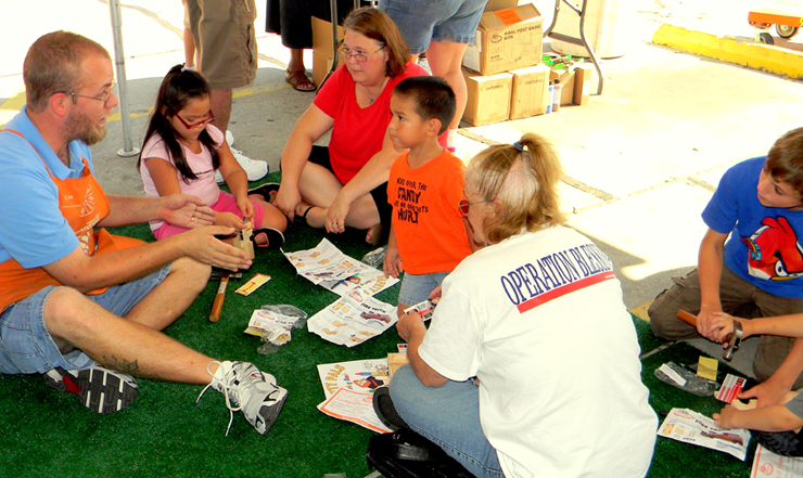 Children, parents and workers from the Home Depot in Chalmette take part in activities at Kids Safety Day on Oct. 6. 