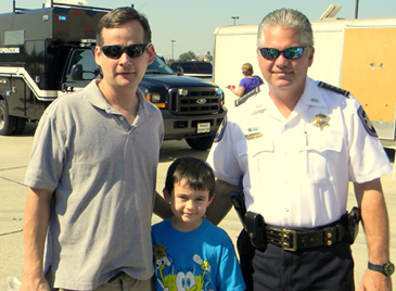 Sheriff James Pohlmann with Jacob Hebert of Chalmette, who just received a Junior Deputy pin, and Jacob’s father, Gary Hebert.