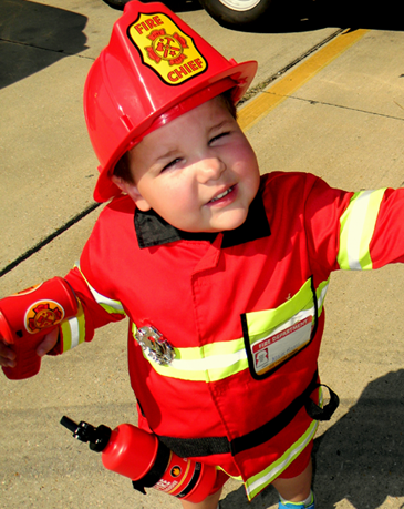 Mark Ragas came to the Kids Safety Day in a fire chief outfit.  