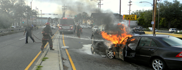 New orleans firefighters extinguish the blaze that started after Robertsons' car caught