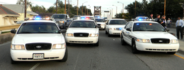 Numerous St. Bernard sheriff's cars are parked on the west-bound lanes of the Industrial Canal bridge on St. Claude Avenue in New Orleans during the Robertson incident. 