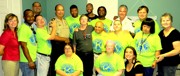 Sheriff Pohlmann has visited twice at the Arc Center since it opened in Chalmette more than a year ago. He is shown here with volunteers and the adults who are brought to the center to work on community projects Monday through Friday.