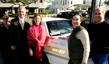 Shown with a vehicle with the new anti-litter message are, from left, Sheriff's Dep. Nicole Miller, Sheriff James Pohlmann, Polly Campbell, executive director of the St. Bernard Community Foundation which donated the stickers; Claudette Reuther, chair lady of the foundation board, and board member Joseph DiFatta.