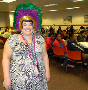   Brie Trocquet, an employee at Jacobs Technology, was festively dressed for the Mardi Gras luncheon, 