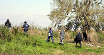 Members of an anthropology team from LSU walk up the ridge in eastern St. Bernard Parish to the site of where they were involved in recovering the body of a man reportedly killed in the city last summer and buried in St. Bernard. NOPD is continuing its investigation, trying to positively identify the victim and his killr. 