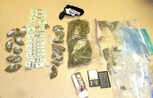 The recovered marijuana, stolen handgun and cash.