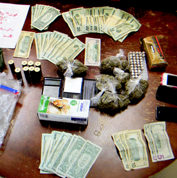 Some of the marijuana and cash recovered in the narcotics seizure