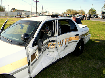 Also shown is the sheriff's patrol car the suspect crashed into, with Lt. Mike Ingargiola behind the vehicle.