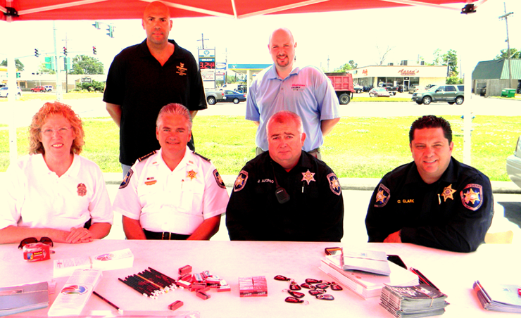 Shown under the tent set up to receive old medications are, front row from left, Lt. Pat Childress, Sheriff James Pohlmann, Sgt. Joey Alfonso and Maj. Chad Clark. In back, from left, are Gerard Robinette, district loss prevention manager for Walgreens and Dustin Mares, community leader for Walgreens stores in St. Bernard Parish and eastern New Orleans. 