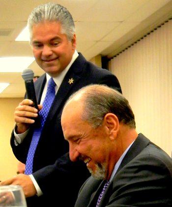 Sheriff James Pohlmann draws a laugh from his former boss.