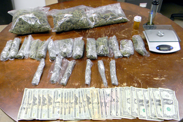 The 2.6 pounds of marijuana, scales and pipe seized in an April 11 arrest of Martin Robin III.