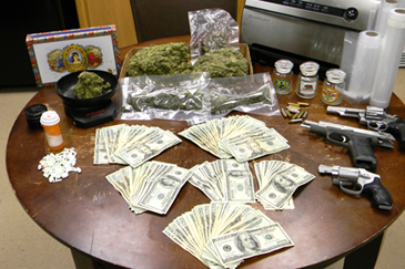 The 1.6 pounds of marijuana, guns and pills, found at the Irby home.