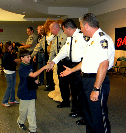 Daren the Lion, mascot of the national D.A.R.E. program,, portrayed by Cpl. Jessica Gernados. 