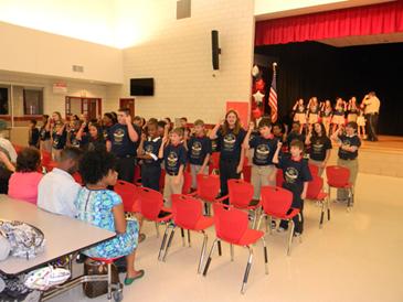 Some of the .D.A.R.E. program graduates at Lacoste Elementary perform the D.A.R.E. theme song.