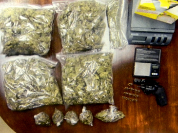 The three pounds of high- grade marijuana and loaded gun seized