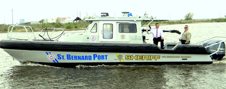 Sheriff James Pohlmann aboard the new patrol boat, with Deputy Sheriff Shane Lulei, one of several sheriff's personnel who are trained to operated the vessel and its scanning system.