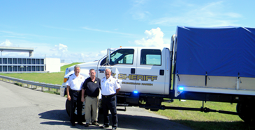 The Sheriff's Office new high-water truck for rescue and moving personnel and equipment, is shown at the Verret floodgate on La. 46 Ext. in eastern St. Bernard Parish. From left are Sheriff James Pohlmann, Capt. Bret Bowen, who heads the equipment division, and Maj. Mark Poche, head of Special Operations.