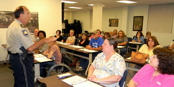 Capt. Charles Borchers talks to the new class of Citizens Police Academy on opening night.