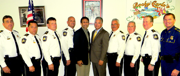 Gov. Jindal and Sheriff Pohlmann surrounded by most of the Sheriff's Office's command staff. At right is Col. Michael Edmonson, superintendent of Louisiana State Police.