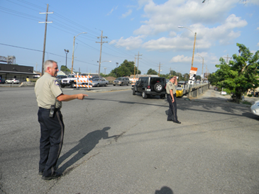 Capt. Walter Dornan, in foreground, and Lt. Mike Ingargiola, both of the St. Bernard Parish Sheriff's Traffic Division, help New Orleans Police and State Police direct traffic on St. Claude Avenue at Poland Avenue the evening of Aug. 8, dealing with increased traffic trying to cross the St. Claude bridge because the Judge Seeber Bridge on Claiborne Avenue is closed to vehicle traffic until Aug. 24. 