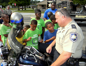 Lt. Mike Ingargiola of the Traffic Division shows off a sheriff's motorycycle, which drew plenty of interest from children.