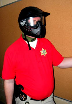 Training Director Maj. David Dimaggio in a helmet with shield.