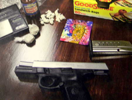 The heroin, crack cocaine, a gun and other items recovered.