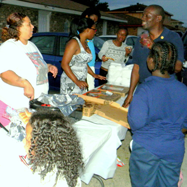 Kevin Gabriel, top right, at a National Night Out Against crime party he hosts in Violet.