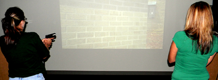 Natalie Seaton, left, and Patsy Cantrell, both of eastern St. Bernard Parish, are shown from behind, with a video on a screen in front of them.