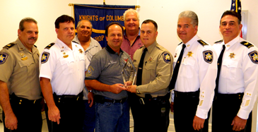 Ryan Melerine was named Deputy of the Year by the Knights of Columbus in Chalmette. Shown, from left, are Det. Capt. Mark Jackson, Chief of Detectives Robert McNab. Grand Knight Cisco Gonzales giving the award to Melerine, Sheriff James Pohlmann and Col. John Doran. In back are Council Chairman Al Graffia and Program Director Fred Billiot