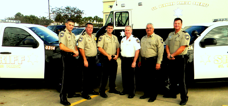 The first two black and white cars, with sheriff's deputies, from left, Lt. Chad Silcio, Capt. C.J. Arcement, Lt. Justin Meyers, Maj. Adolph Kreger, Maj. Mark Poche and Lt. Ray Whitfield.
