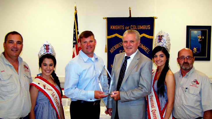 Knights of Columbus Rummel Council St. Bernard Deputy of the Year Lt. Brent Bourgeois, third from left,with Grand Knight Larry Gonzales, Carley Gravois, who is Teen Queen of the Knights of Columbus Louisiana Crawfish Festival for 2011; Sheriff's Office Deputy Chief Richard Baumy, Crawfish Festival Queen Victoria Holmes and Darrel Gonzales, District Deputy. 