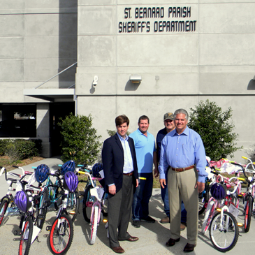 Shown with the bicycles donated by Associated Terminals to the Sheriff's Office are, in front at left, Zeljko Franks, Senior Vice-President, and Sheriff James Pohlmann; in back are Jason Perez, operations manager, and Lou Fos, crane manger. 