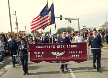 Chalmette High's marching band approaches.