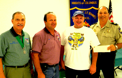 Official from the Sheriff's Office Reserve Division accepted a $2,000 donation Aug. 24 from the Knights of Columbus Archbishop Rummel Council 5747 in Chalmette. Shown, from left, are the group's past Grand Knight Ruben Saavedra, Grand Knight Cisco Gonzales, Reserve Division Lt. Tony Jeansonne - who is also treasurer for the Knights of Columbus Council - and Capt. Charles Borchers, head of the Reserve Division 