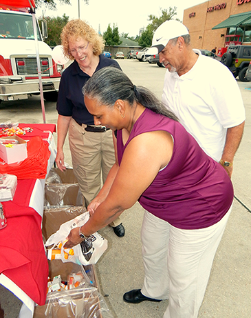 Jeanne and Gregory Keys of New Orleans turned in medications at the take-back day. Behind them is Capt. Pat Childress, a sheriff's deputy assigned to a DEA task force who was present to collect the surrendered drugs.