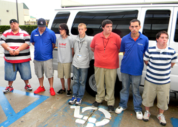 The seven defendants in the Lebeau Mansion arson fire of Nov. 22, 2013 – shown about to enter a jail van after their arrests that day – have all pleaded guilty and been sentenced. Shown from left are Bryon Meek, Dusten Davenport, Kevin Barbe, Joshua Allen, Jerry Hamblen, Joseph Landin and Joshua Brisco. 