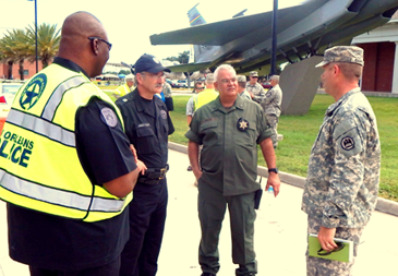From left, New Orleans Police Sgt. Sherman Joseph, Capt. Jimmy Scott, head of the NOPD SWAT team; St. Bernard Sheriff;'s Office Maj. Mark Poche, head of the Special Operations Division; and Lt. Col. Kenneth Copple, deputy base commander, discuss the active shooter drill at Jackson Barracks. 