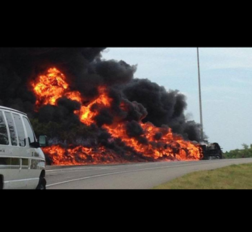 An overturned tanker truck on fire on Interstate-10 in eastern New Orleans on Aug. 26 after its driver was rescued.