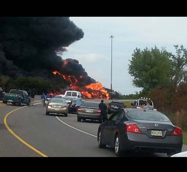 Vehicles are backed up on the interstate by the fiery accident.