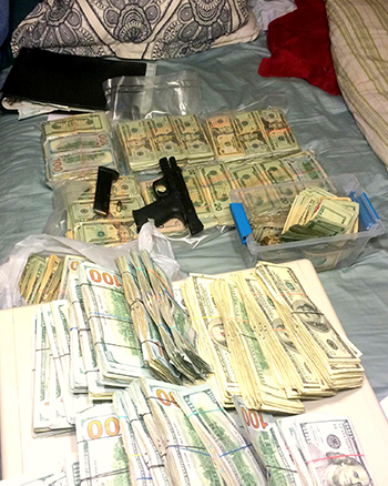 Some $425,000 in drug cash and a gun seized in a a multi-agency effort including the St. Bernard Parish Sheriff's Office Special Investigation Division.